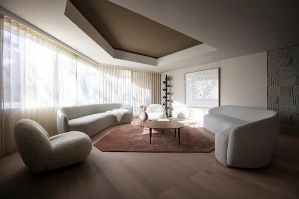 A minimalist hotel interior bathed in warm natural light